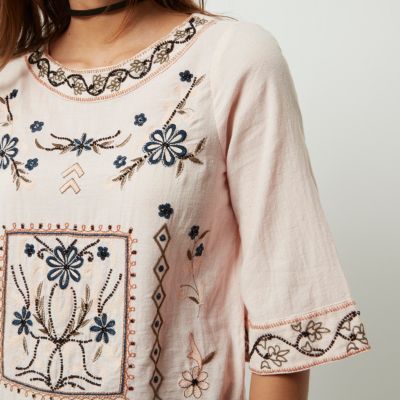 Light pink flared sleeve embroidered top